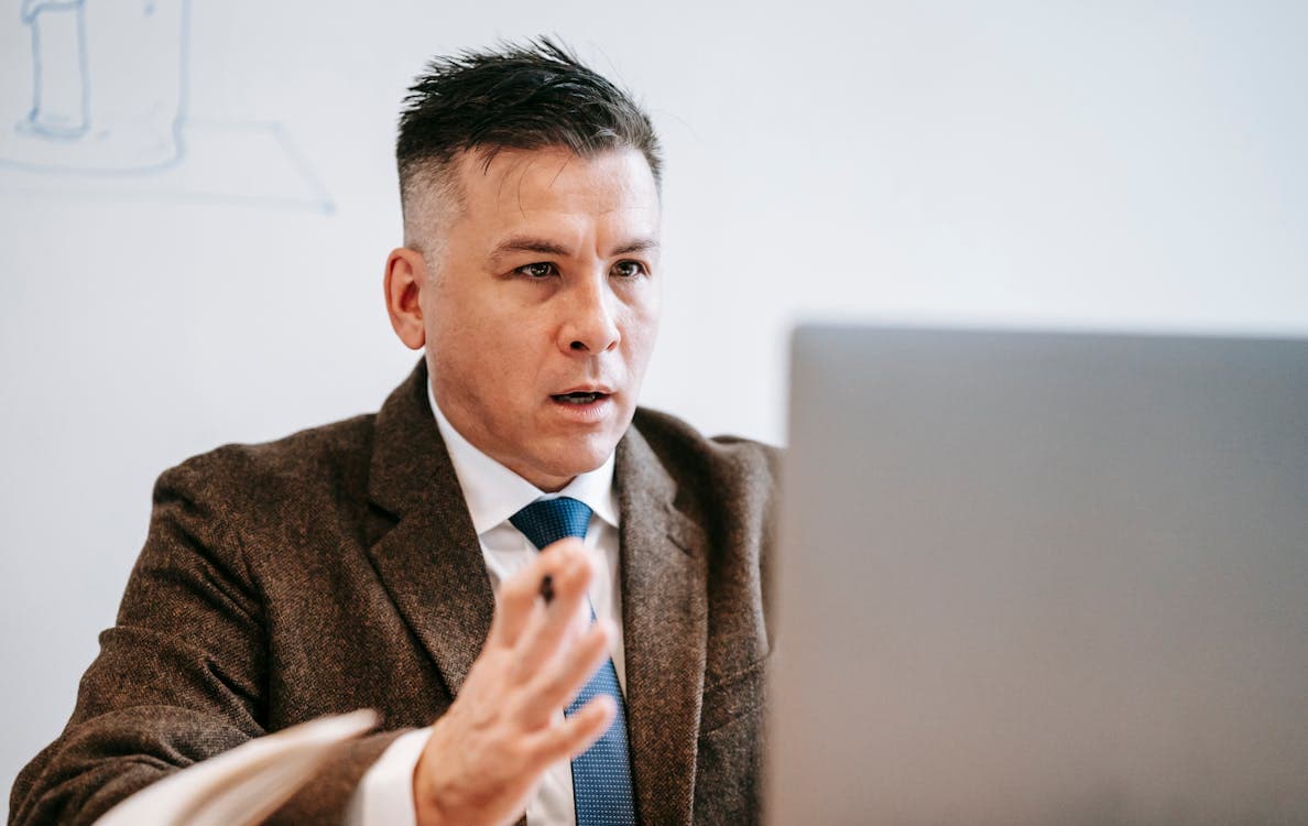 Small business owner reviewing Microsoft 365 plan options on a laptop